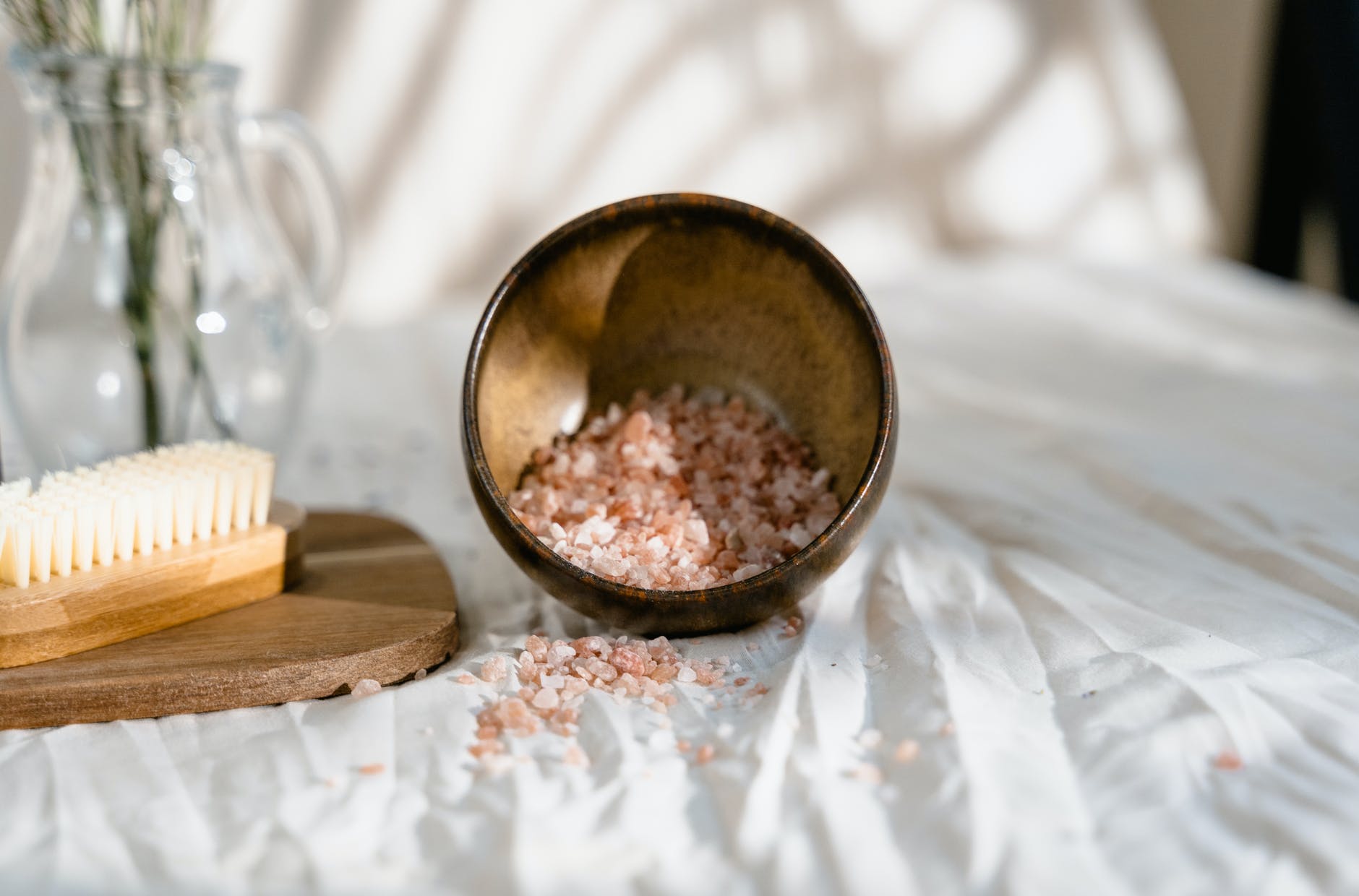 brown wooden round bowl on white textile