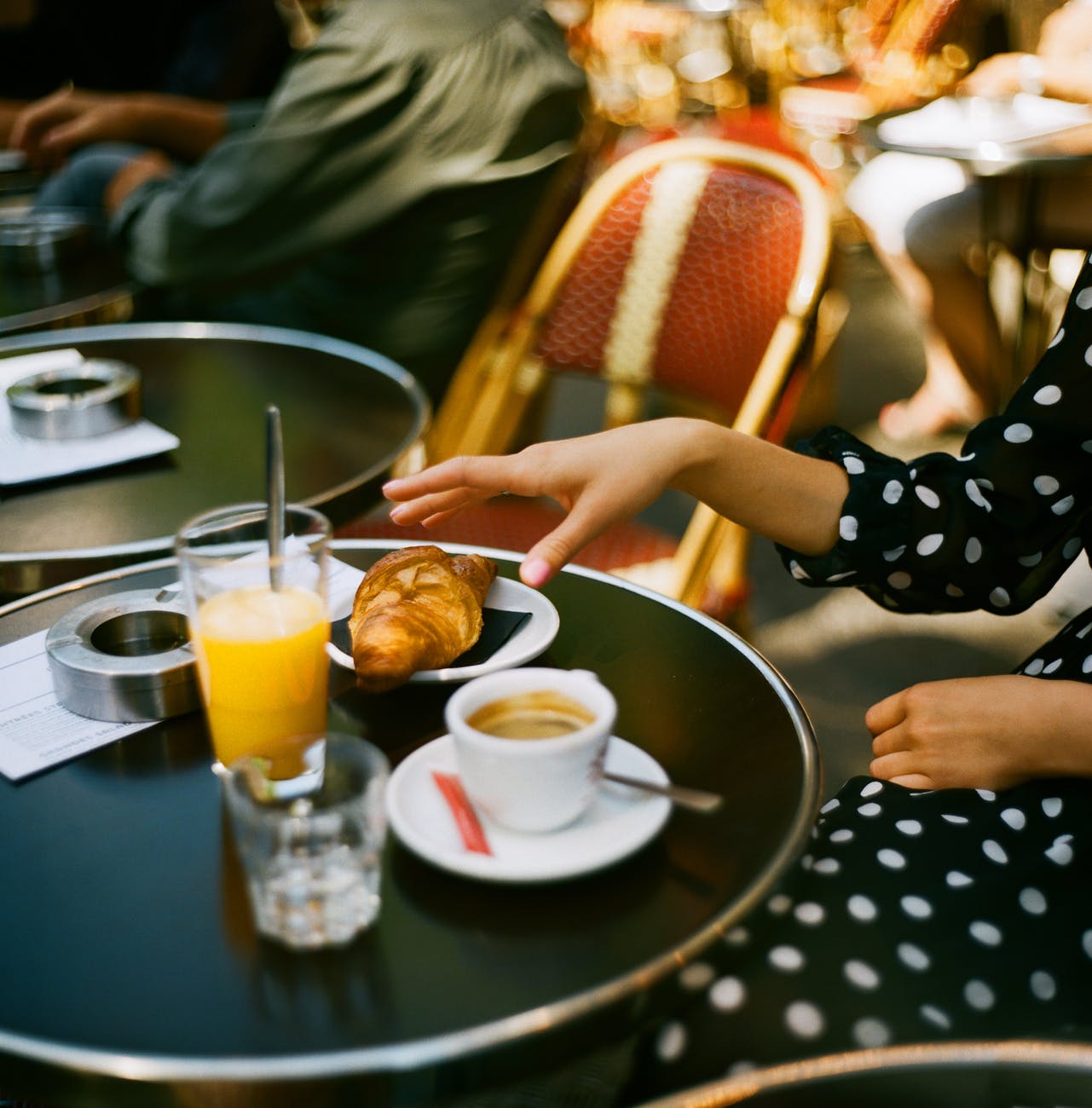 Chic Style Collective | 5 Secret Foodie Places to Visit in Paris. Places to visit in Paris
photo of persons hand getting a bread