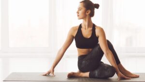 Chic Style Collective | The Elegant Athlete: The High-Value Sports Hobbies Wealthy Women Swear By Yoga Workout (Shutterstock)